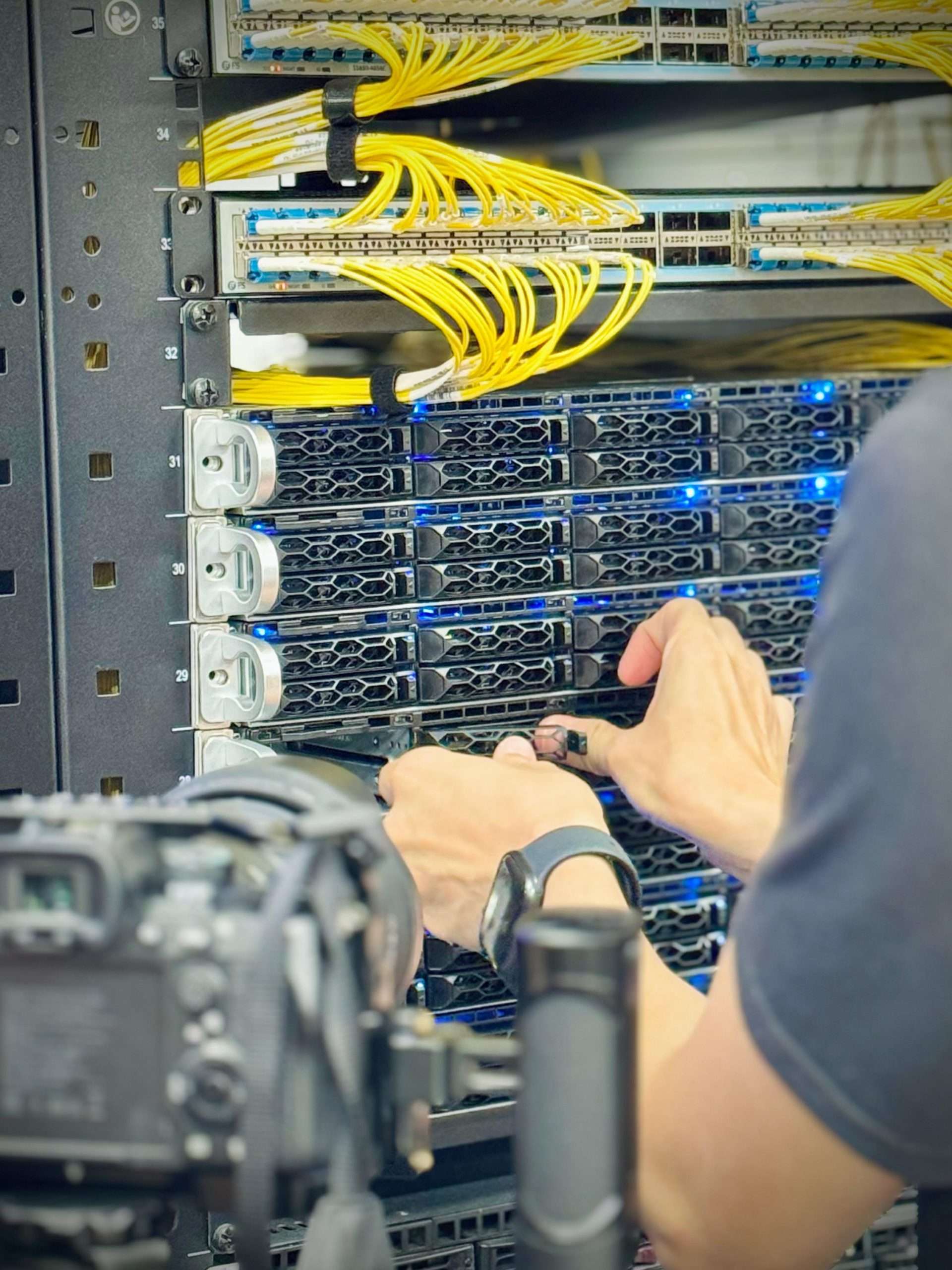 man-working-on-a-server-rack